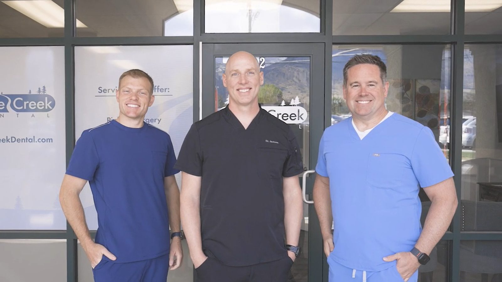 The three dentists of Grove Creek Dental outside the practice